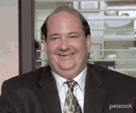 Kevin de The Office con sonrisa pícara